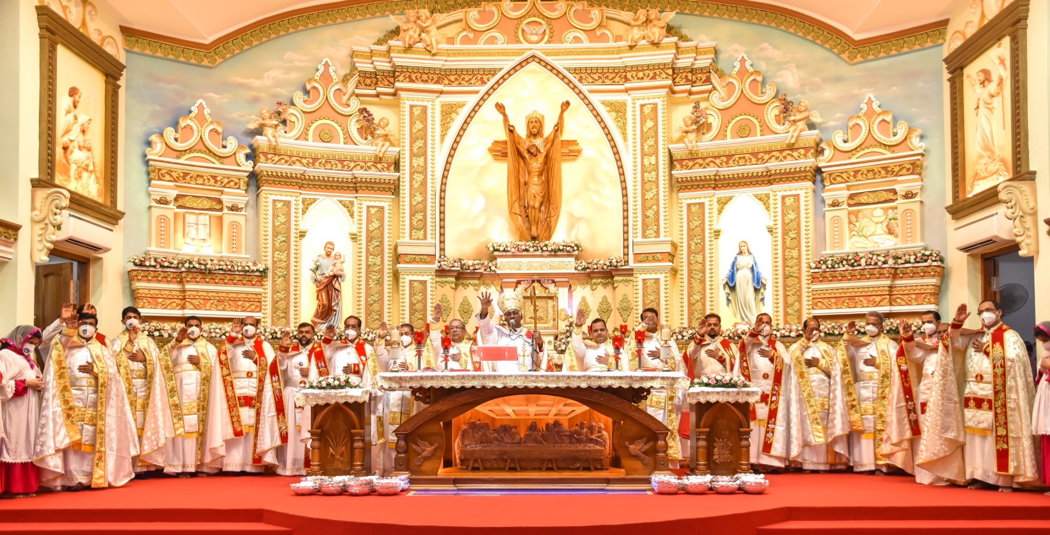 Clergy gathered at the altar for consecration Holy Qurbana