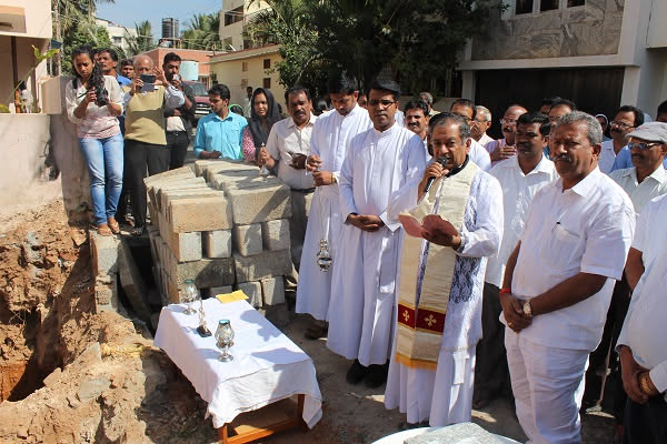 Priests and parishioners gathered at the foundation site