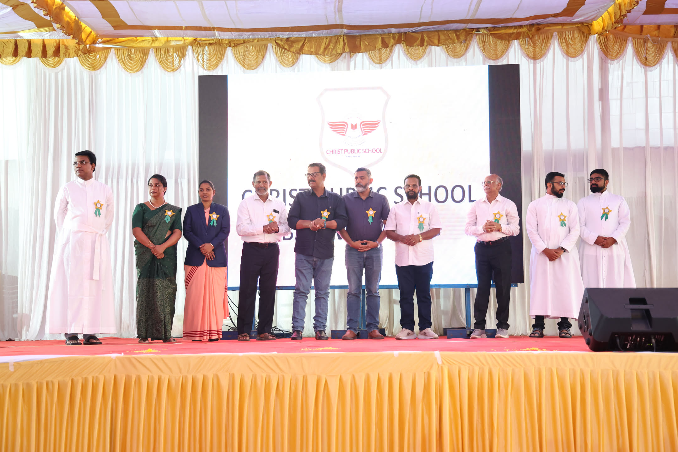 Guests and parish leaders on stage at the school inauguration